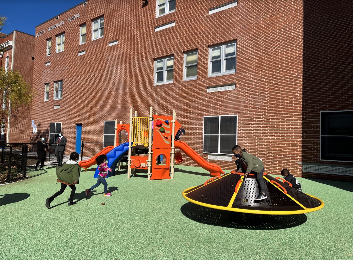 Kids playing on new playground