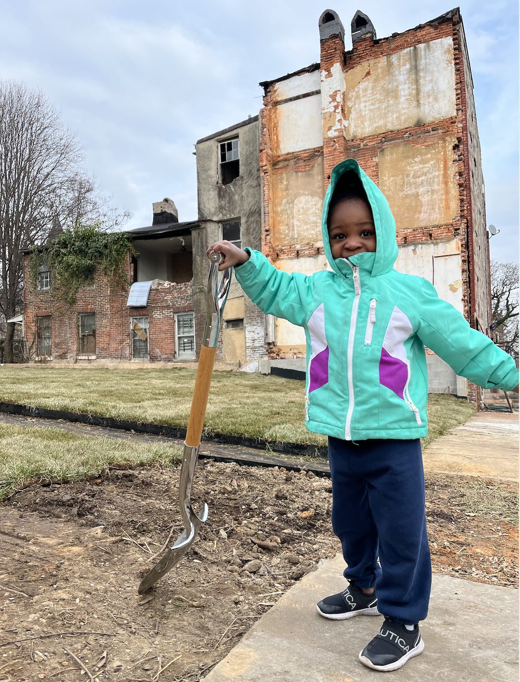 Little girl with shovel at park groundbreaking